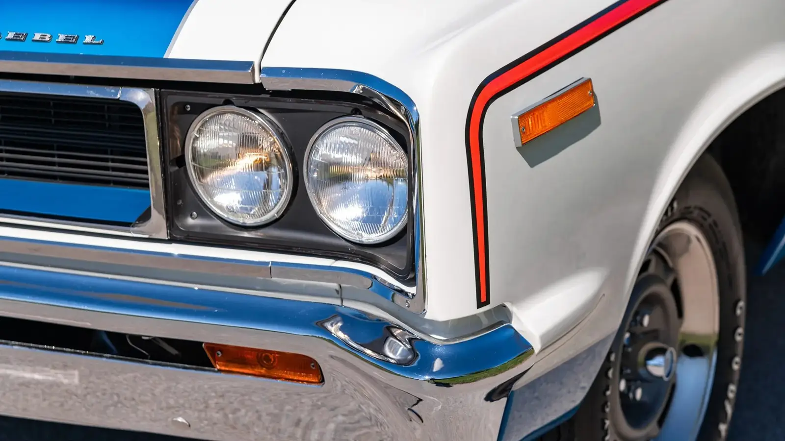 The rare 1970 AMC Rebel Machine parked outdoors showcasing its iconic patriotic color scheme