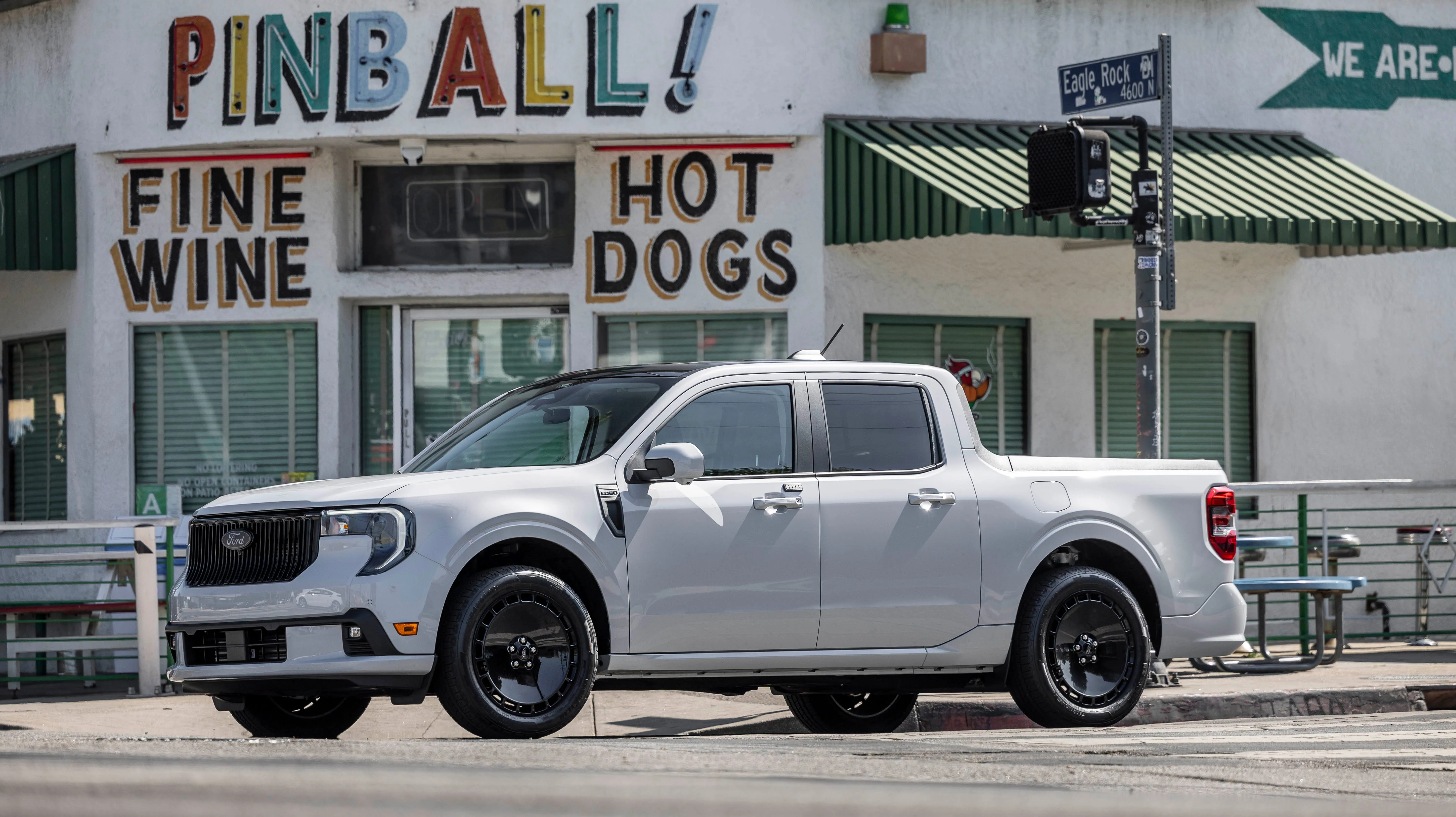 2026 Ford Maverick Lobo parked on a bustling street in Long Beach showcasing its compact urban design