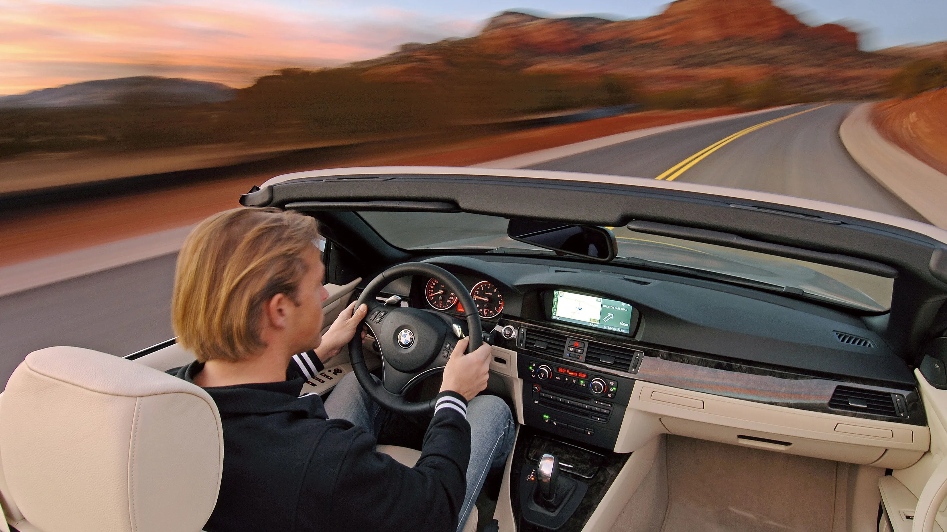BMW 335i Convertible showcases retractable hardtop and twin-turbo performance on open roads