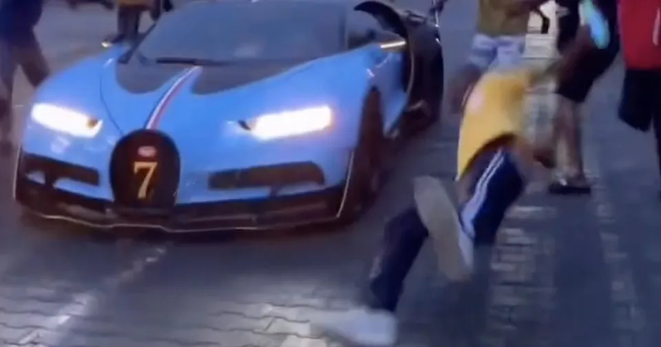 Burna Boy drives his custom Bugatti Chiron VXX Special Edition through the streets of Lagos