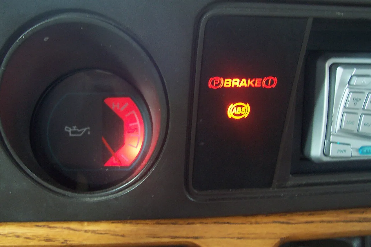 Car dashboard warning lights and tell-tale indicators display vehicle system status