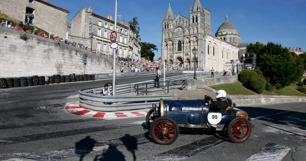 Classic cars parade around the historic ramparts of Angouleme for the Circuit des Remparts