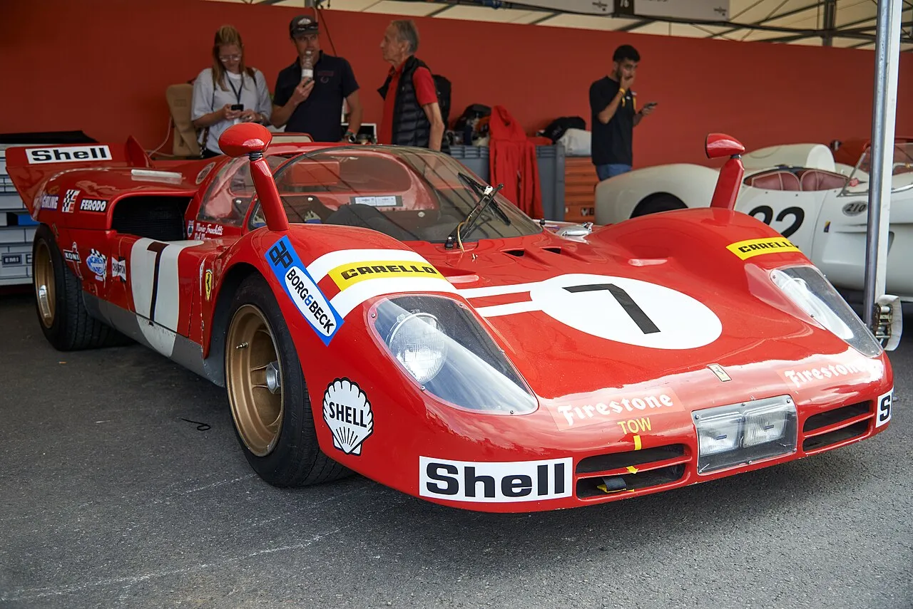Ferrari 512 sports prototype racing car on display showcasing its powerful V12 engine design