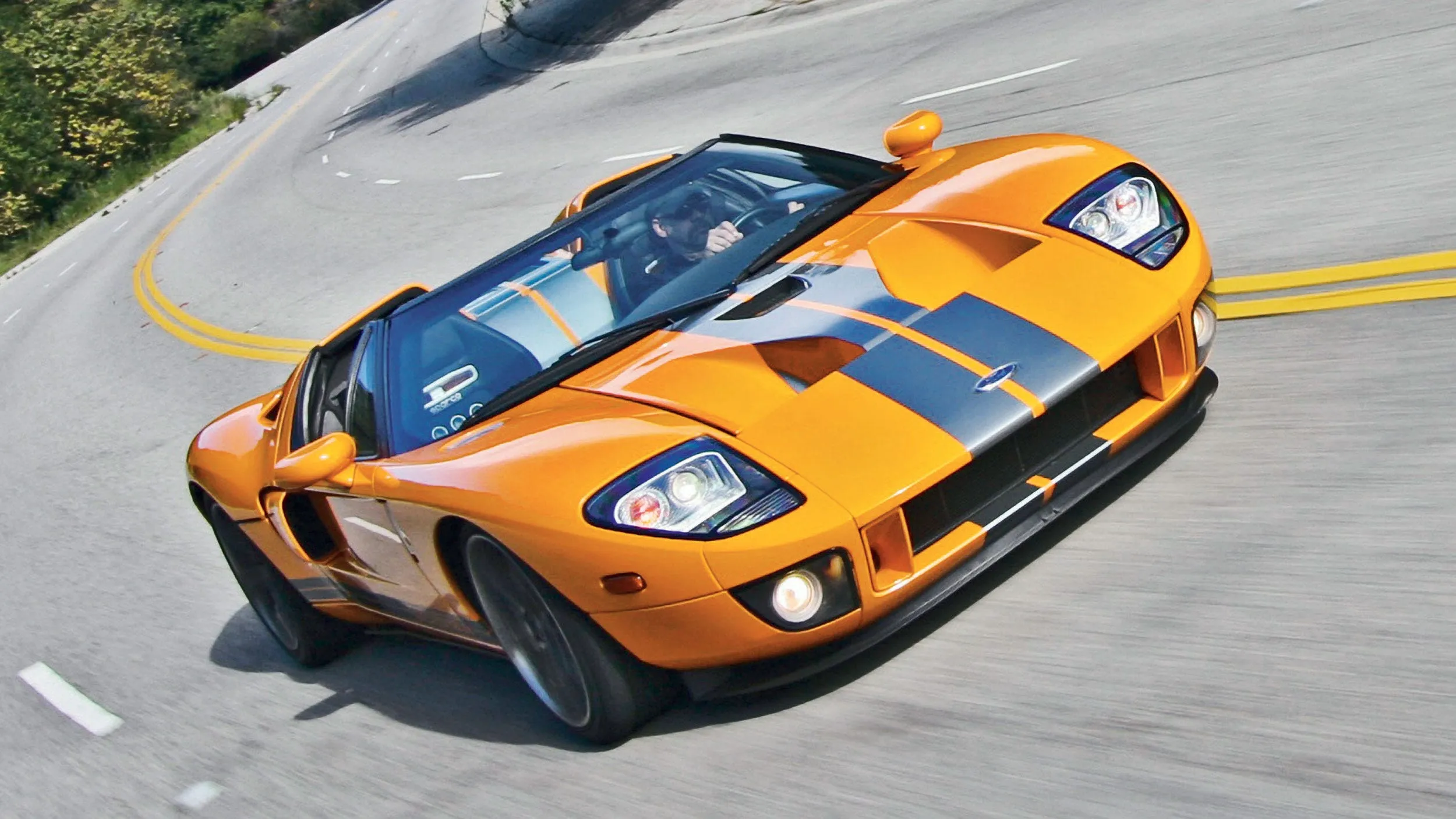 Ford GTX1 open-top roadster showcasing its aggressive orange paint and supercar design