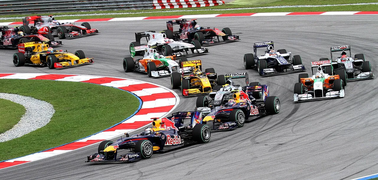 Formula One cars racing on track showcasing cutting edge speed and aerodynamics