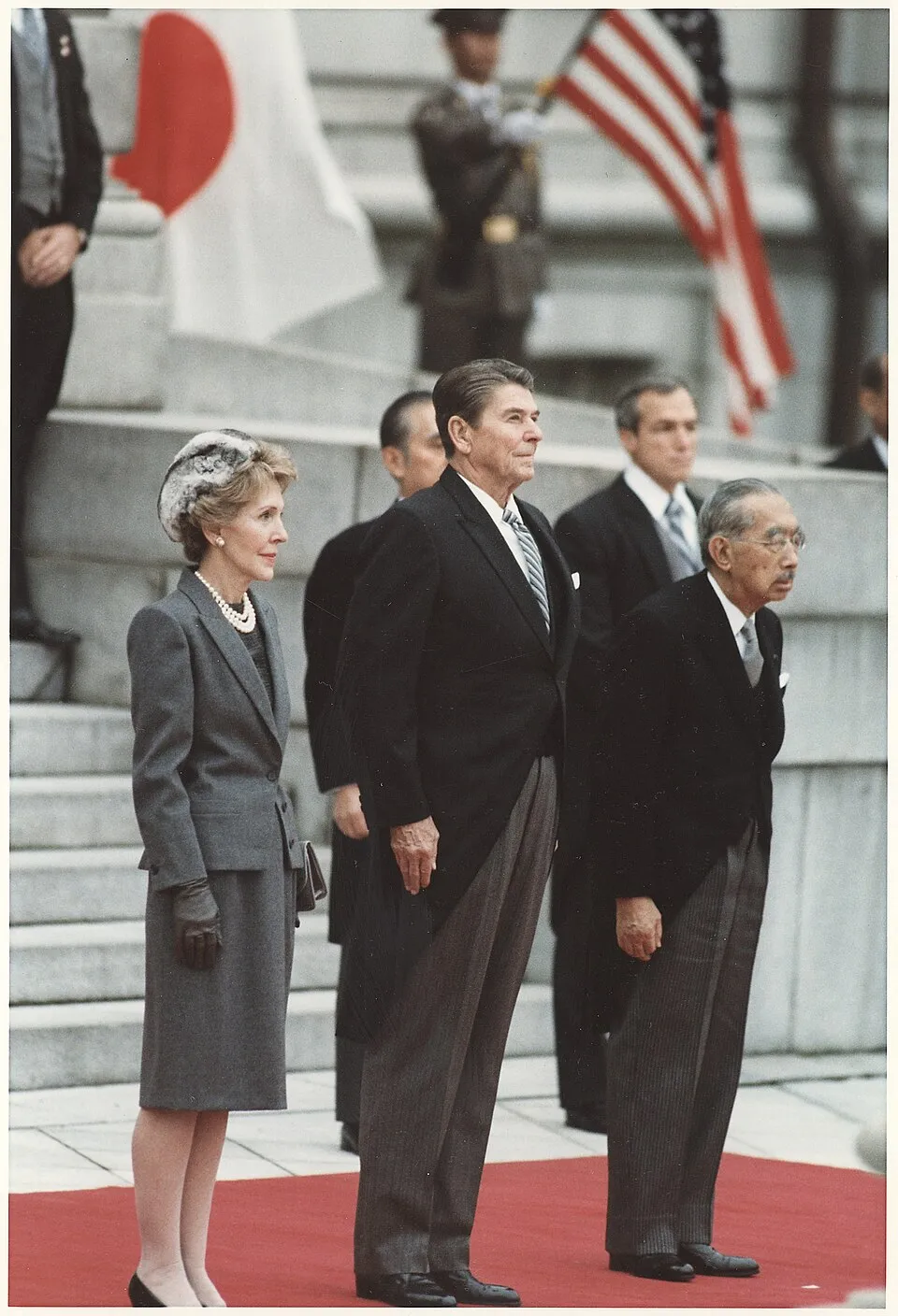 Gentlemen showcasing traditional morning dress at a formal royal event