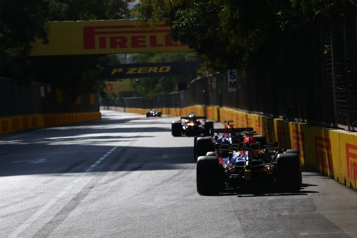 George Russell celebrates winning the Azerbaijan Grand Prix in Baku ahead of Max Verstappen