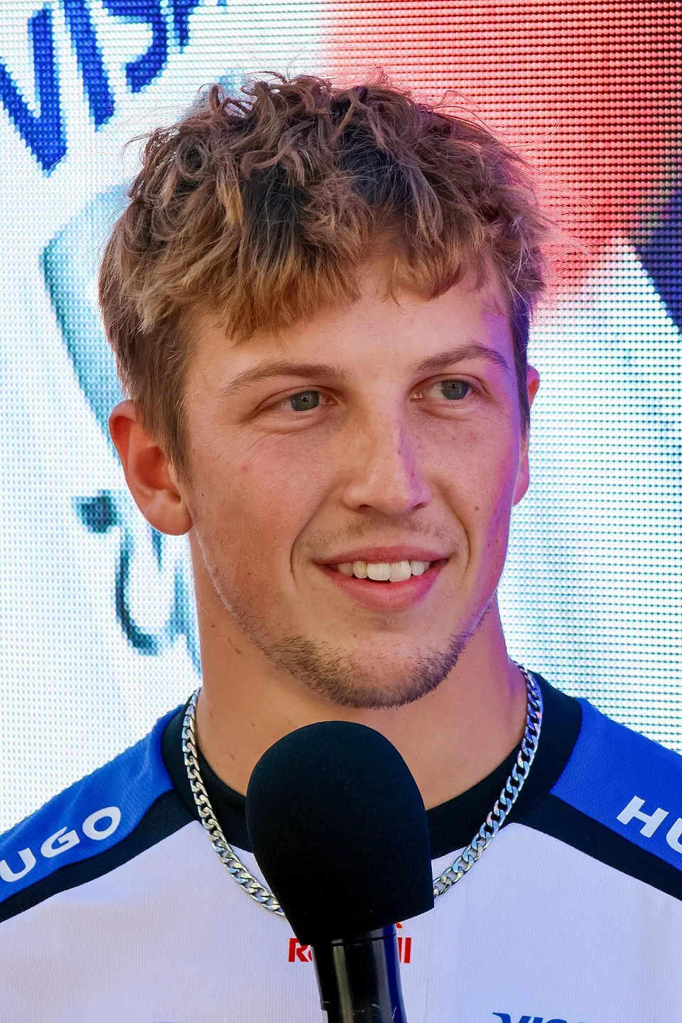 Liam Lawson navigates a Formula One car during high-stakes Grand Prix competition