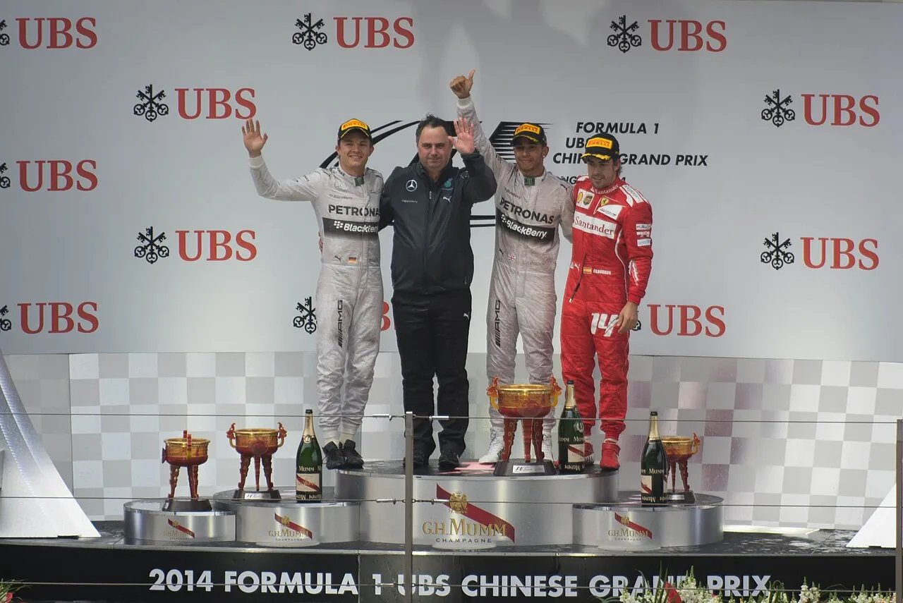 Ron Meadows on the podium during the 2014 Chinese Grand Prix representing Mercedes F1 success
