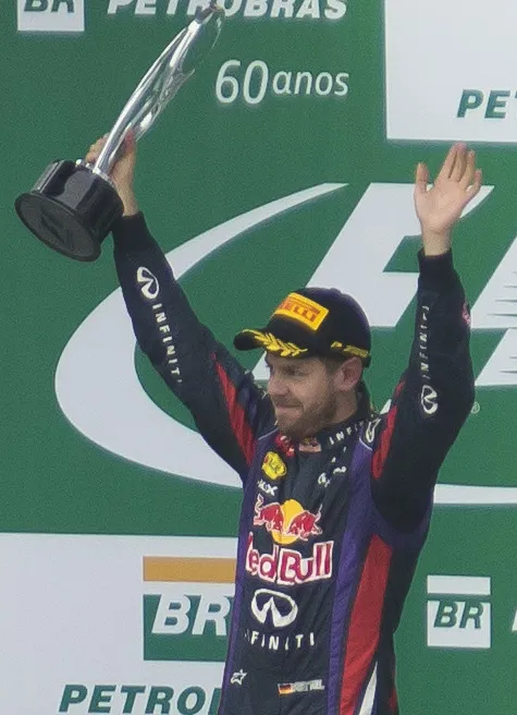Sebastian Vettel celebrates his fourth consecutive Formula One world title with Red Bull Racing in 2013