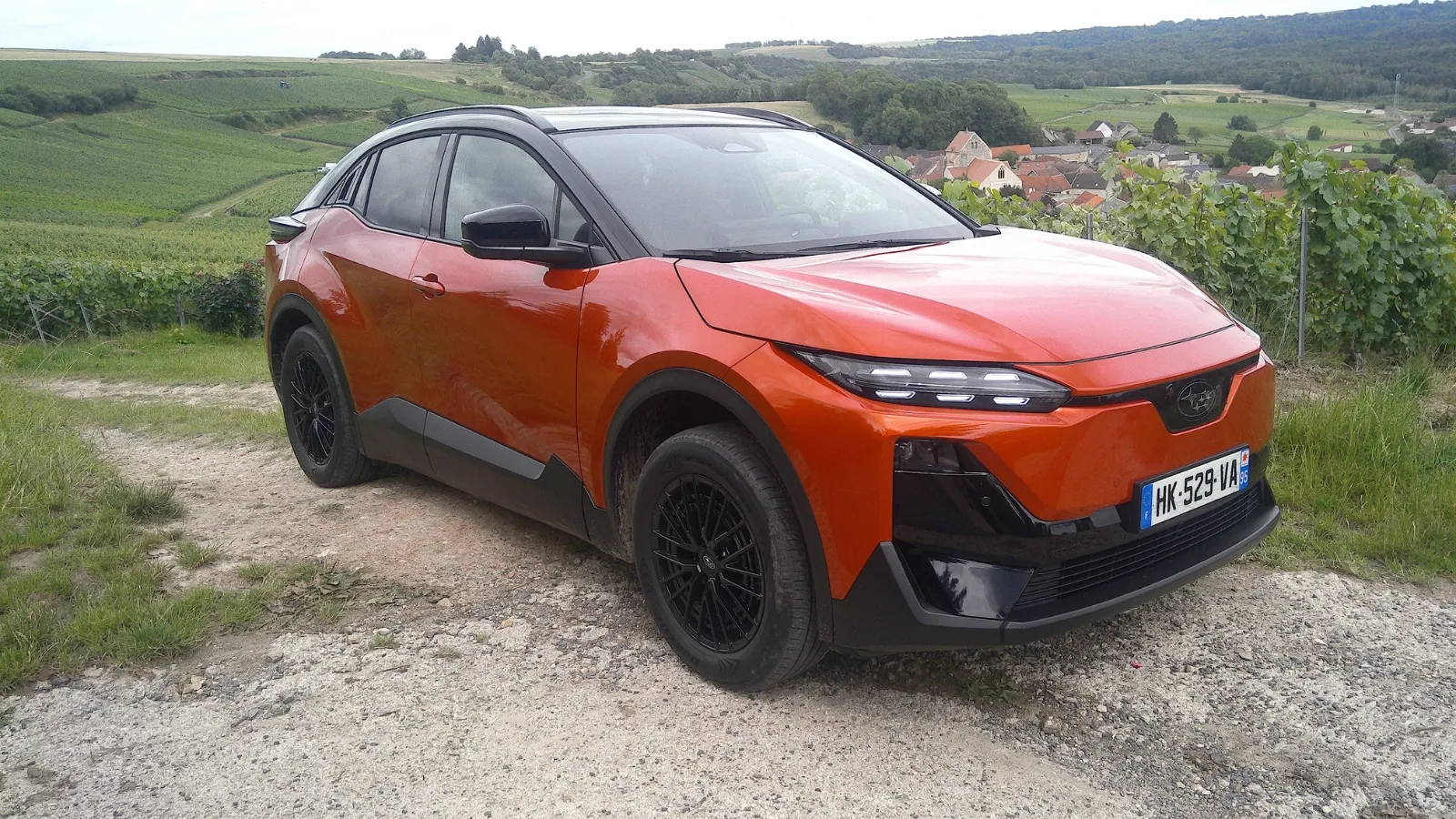 Subaru Uncharted electric SUV parked during media test drive showcasing its coupe styling